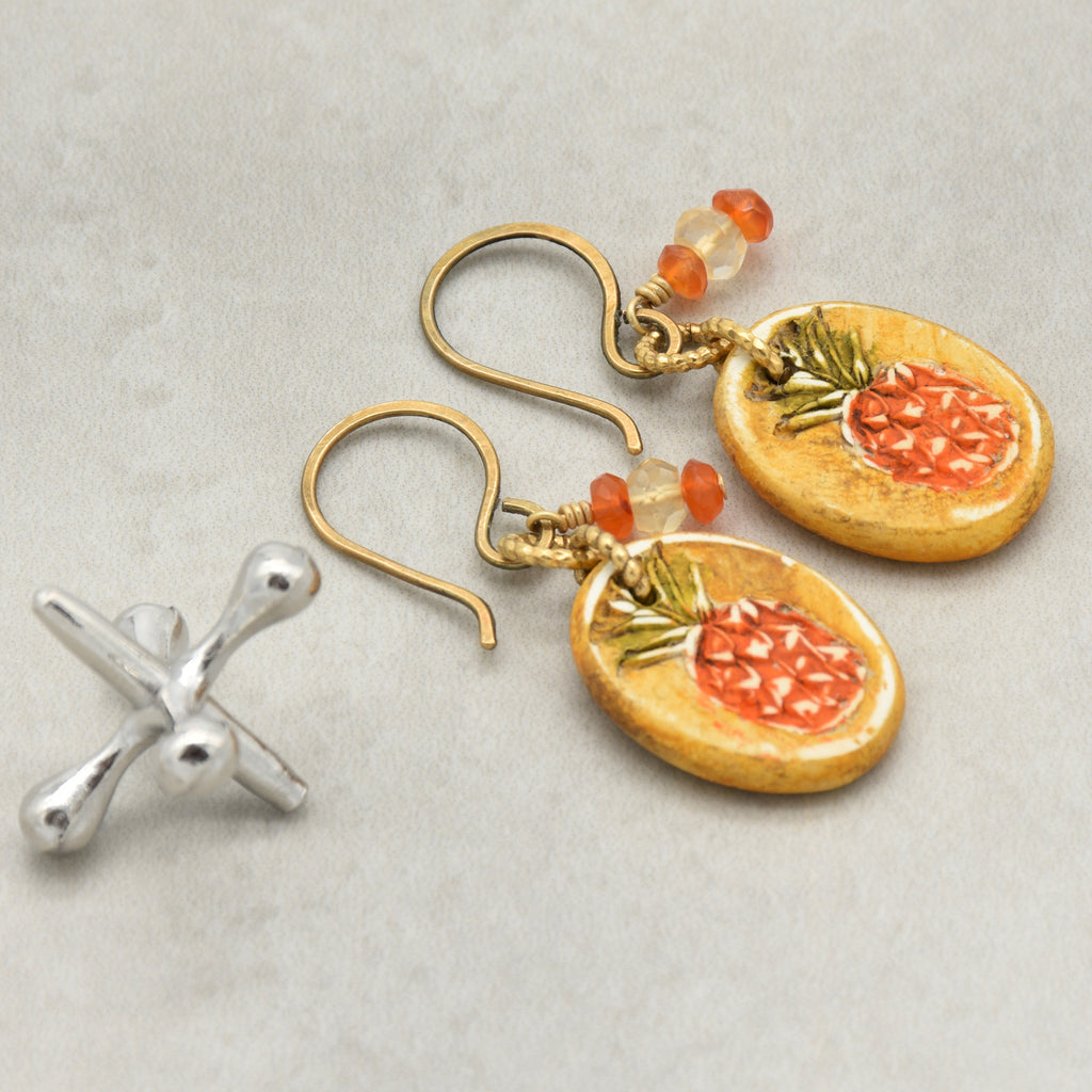 Handmade Pineapple charm earrings with brass ear wires on a light surface - made with love by Ruby Acorn