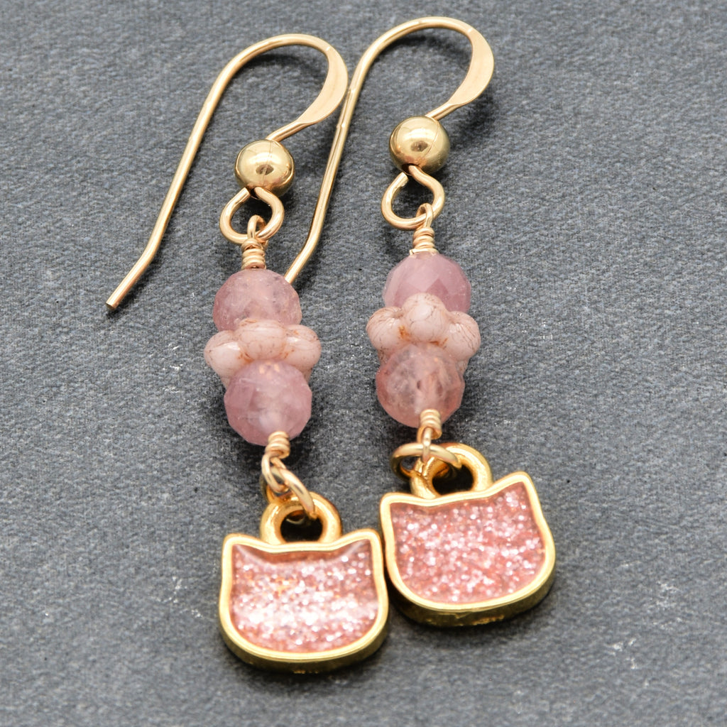 Lovely delicate pink dangle earrings with cat charms, pink tourmaline, and gold ear wires on a gray background - handmade with love by Ruby Acorn