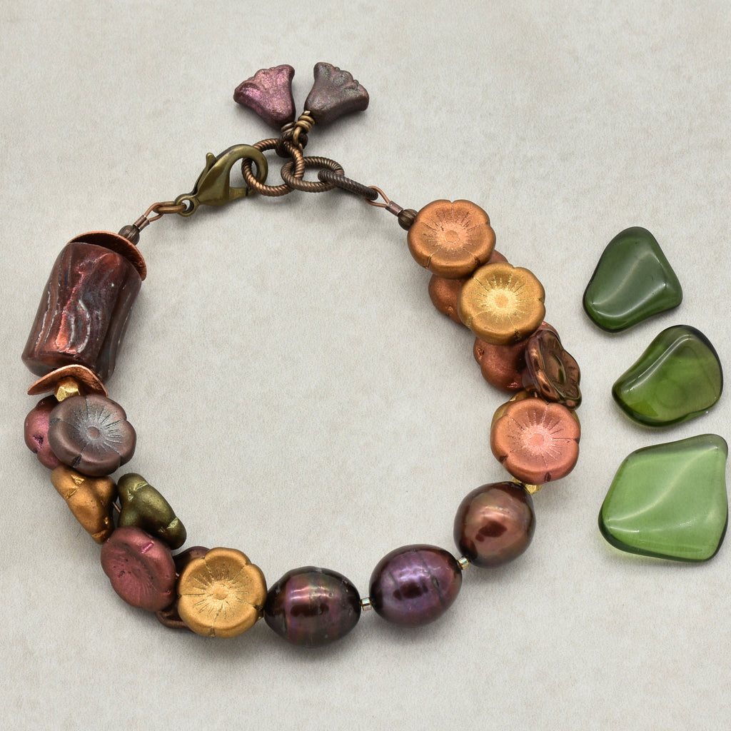 Colorful beaded bracelet with natural stone accents on a textured surface
