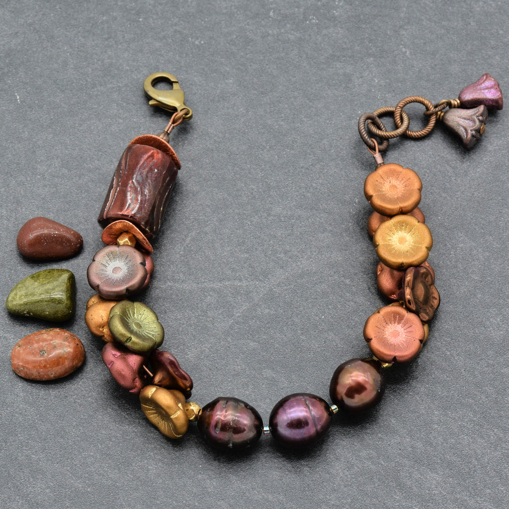 Colorful beaded bracelet on a gray background