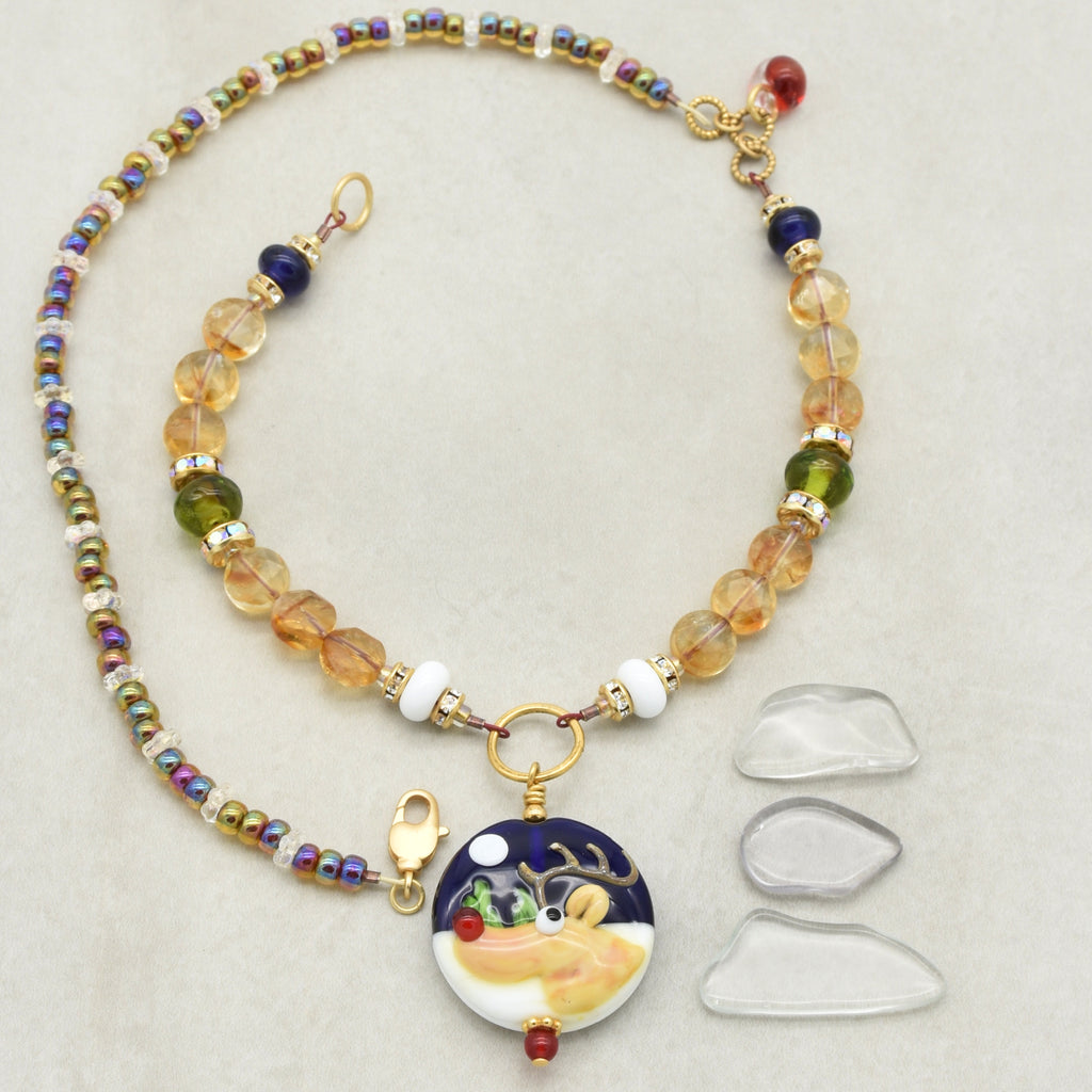 Colorful beaded necklace with a reindeer pendant on a light gray background