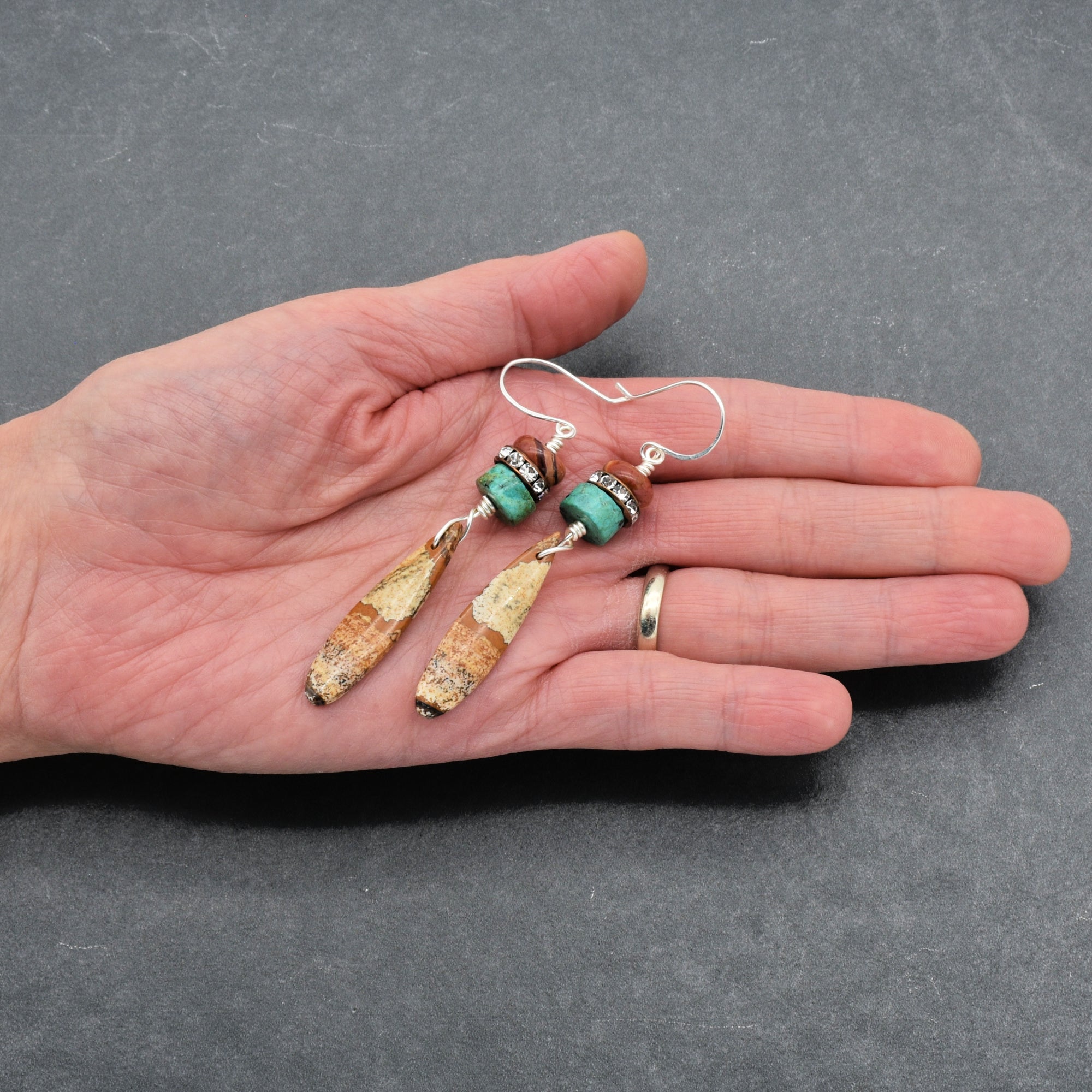 The image shows a pair of earrings.