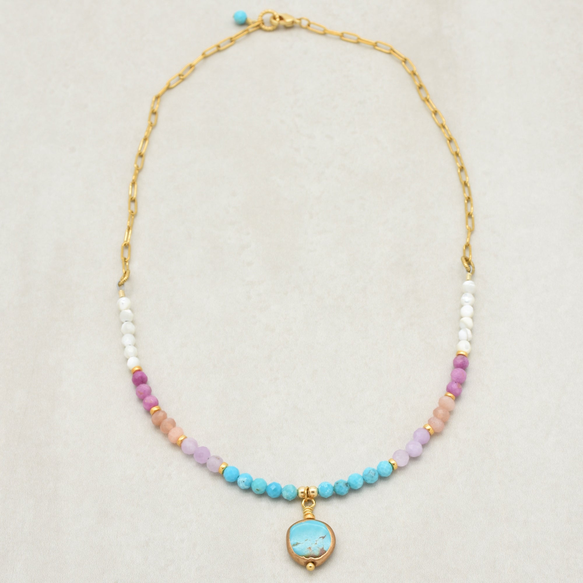 Multi gem gold chain choker necklace with genuine turquoise focal, kunzite, peach moonstone, and more on a light background - made with love by Ruby Acorn