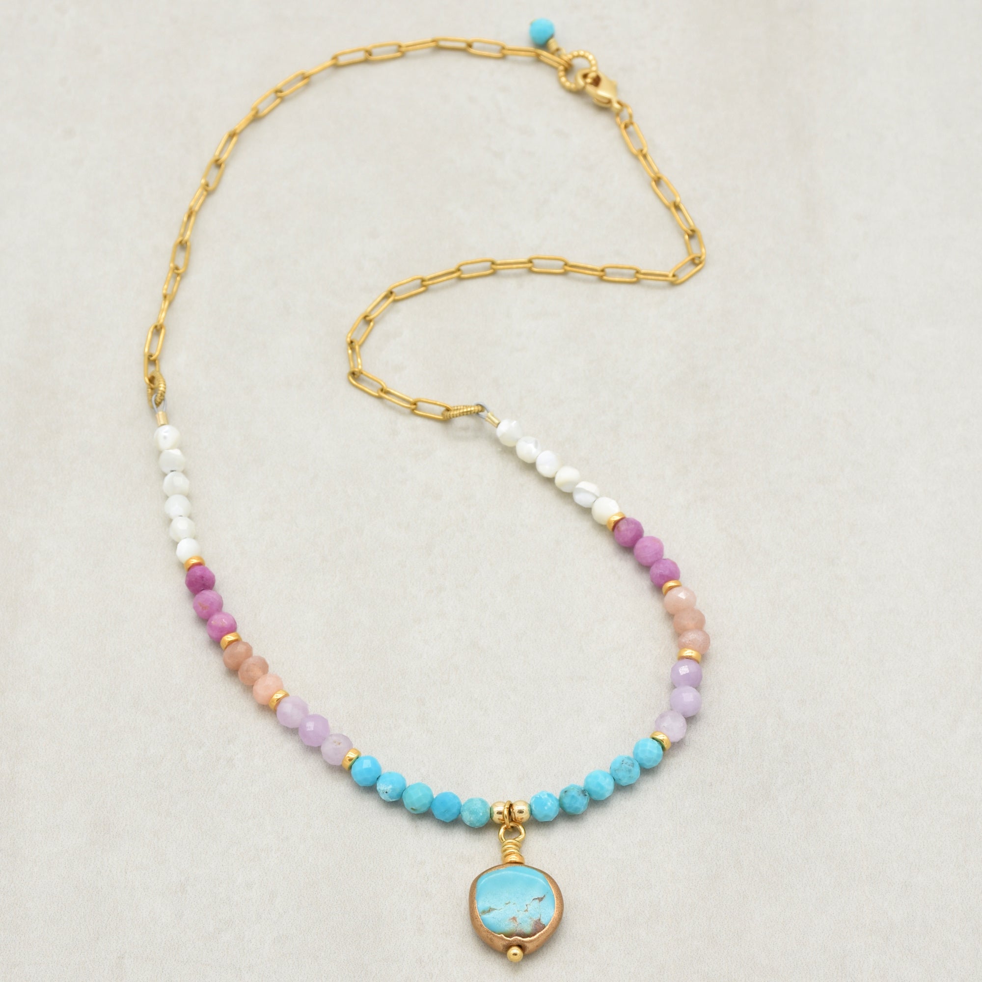 Multi gem gold chain choker necklace with genuine turquoise focal, kunzite, peach moonstone, and more on a light background - made with love by Ruby Acorn