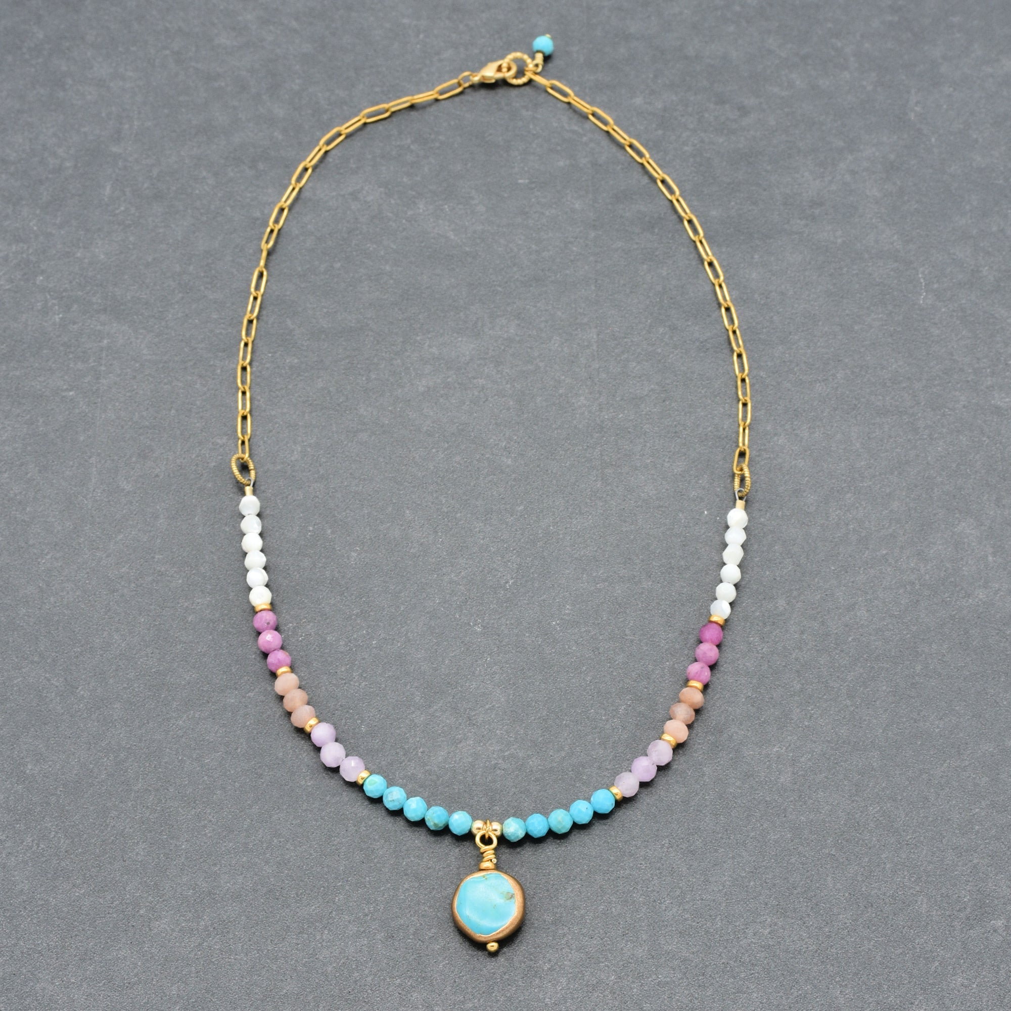 Multi gem gold chain choker necklace with genuine turquoise focal, kunzite, peach moonstone, and more on a gray background - made with love by Ruby Acorn