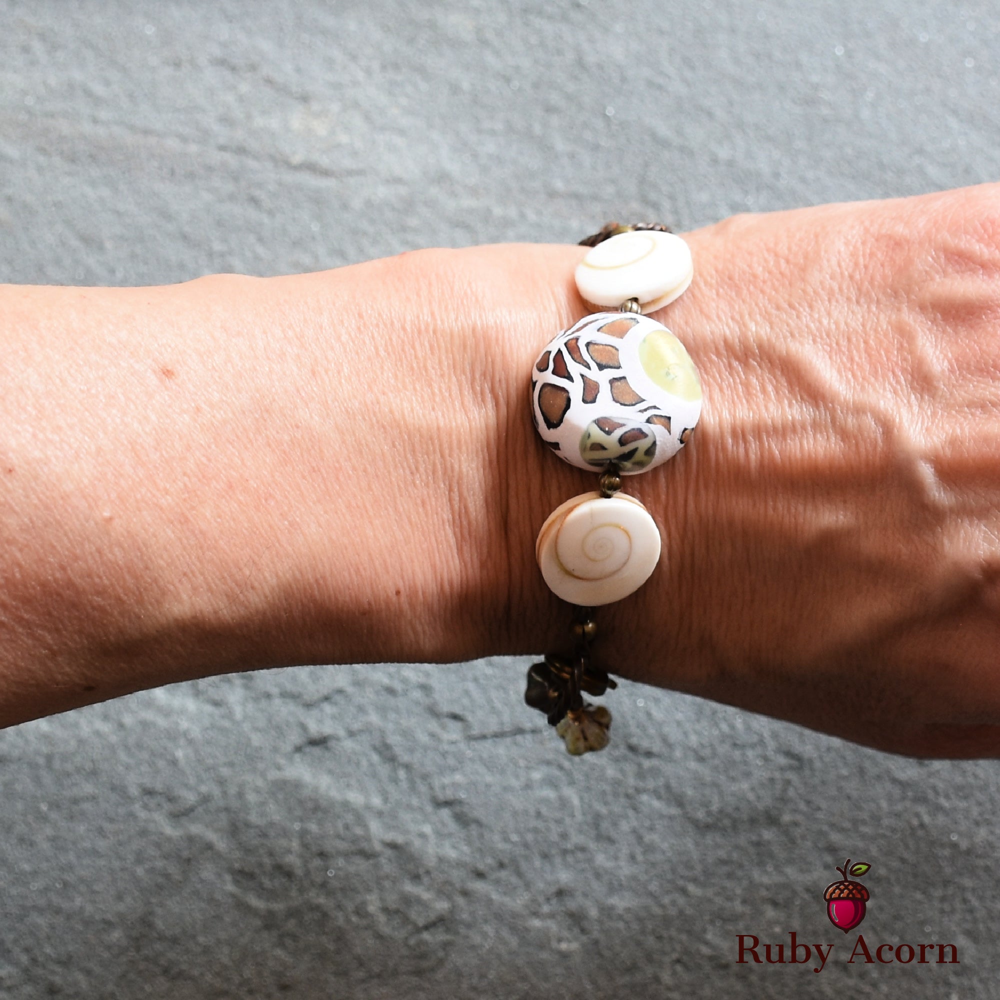 Swanky Safari Handmade Beaded Bracelet with Artisan Polymer Clay Green Giraffe Focal, Shell, Czech Glass Flowers