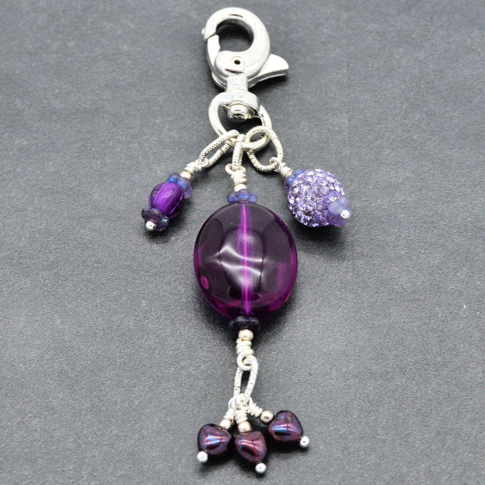 Violet Purple handbag charm with Lucite, pave and Czech glass hearts on a gray background - handmade with love by Ruby Acorn