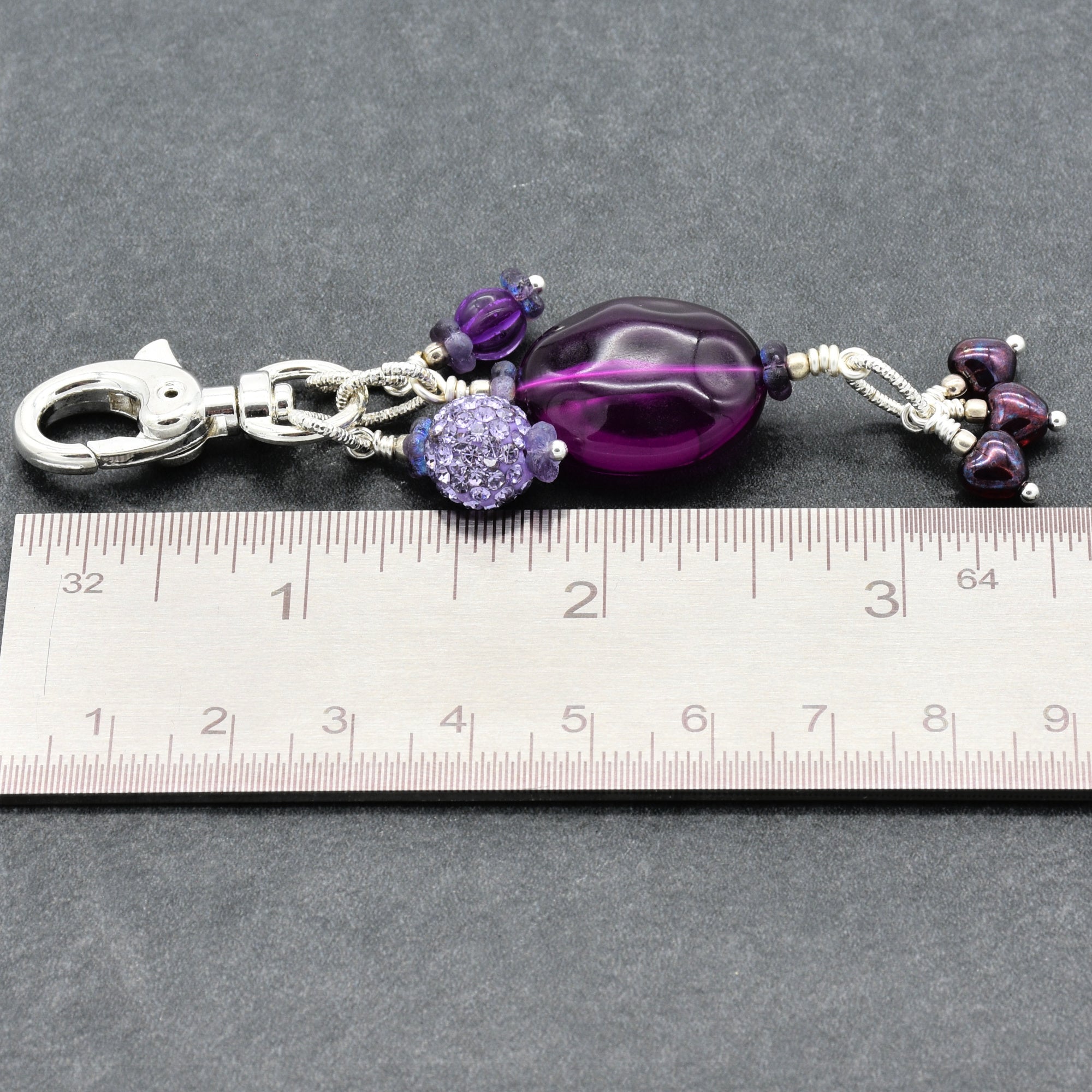 Violet Purple handbag charm with Lucite, pave and Czech glass hearts next to a ruler for scale - handmade with love by Ruby Acorn