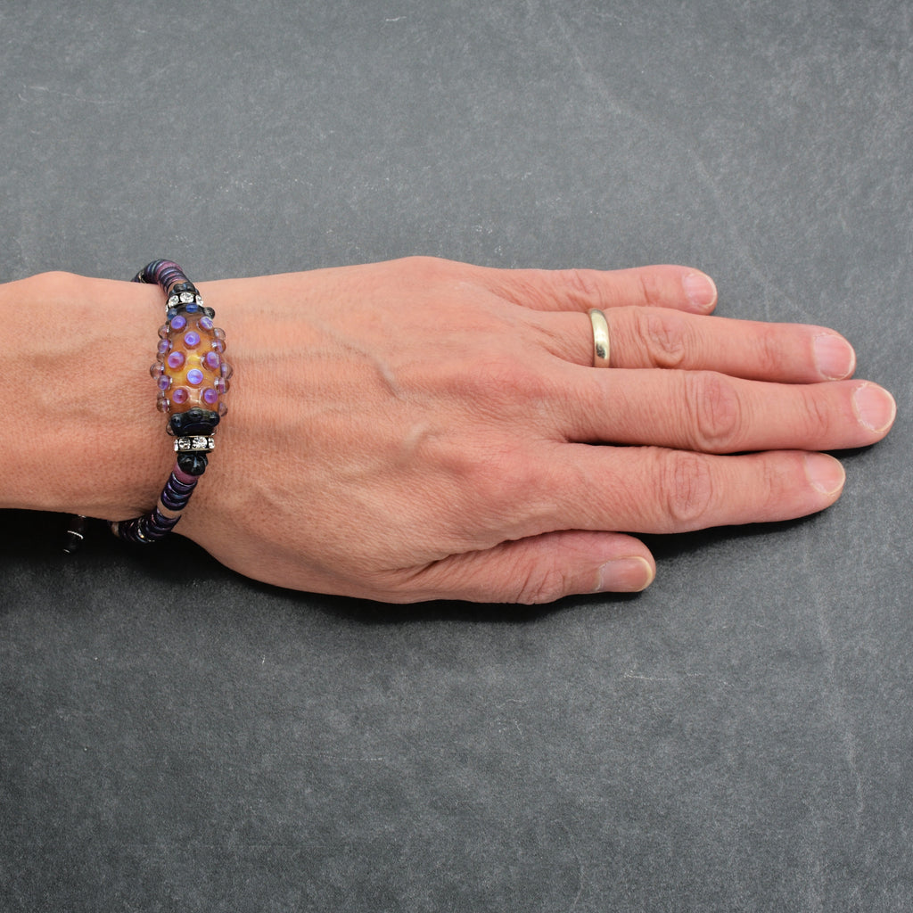 The image shows a bracelet on the person's wrist.