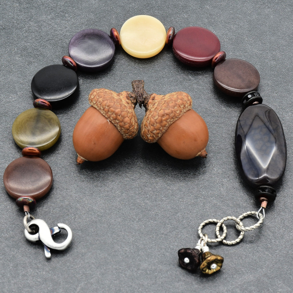 Bracelet with colorful beads on a gray surface