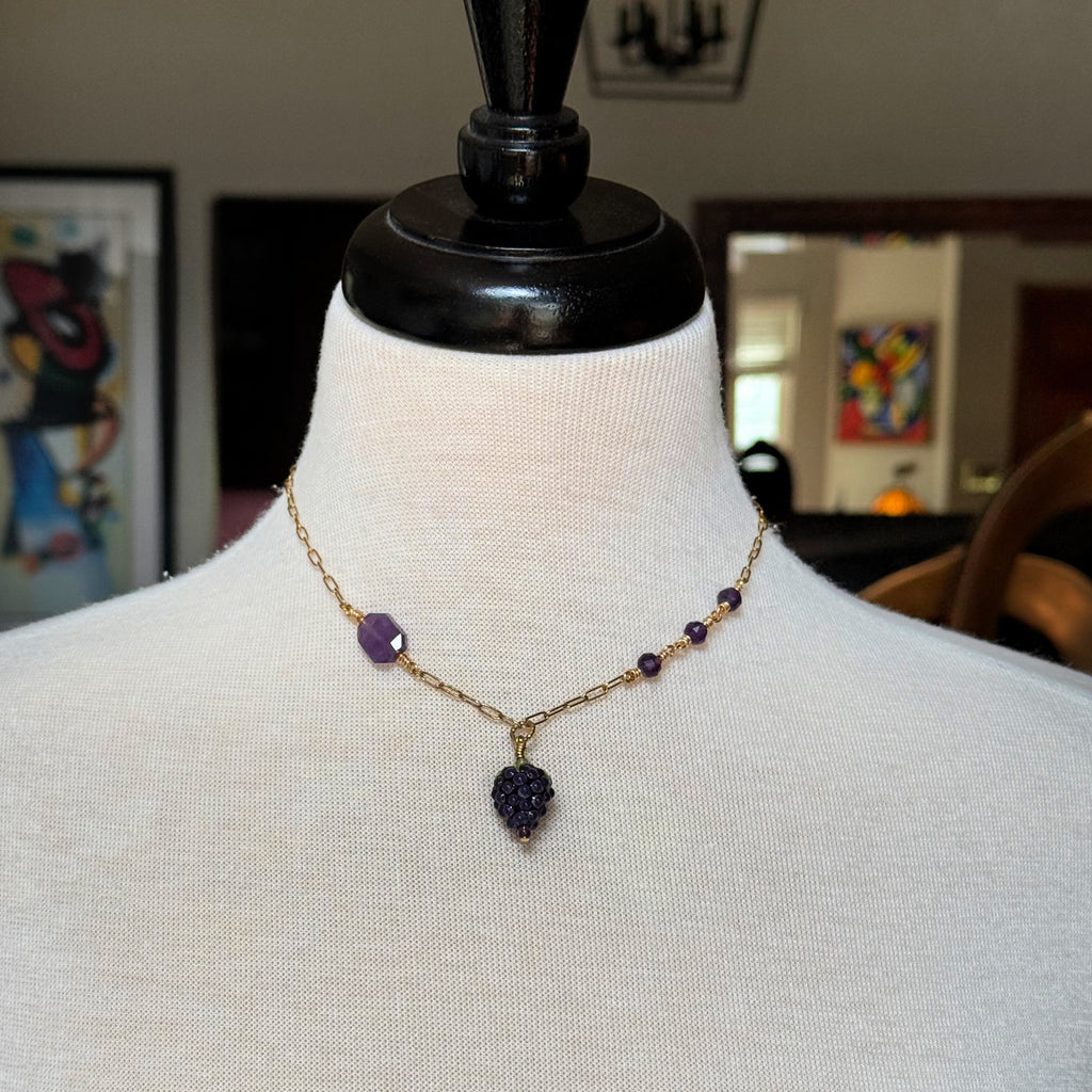 Mannequin wearing asymmetrical gold chain necklace with artisan lampwork glass blackberry focal and amethyst - handmade with love by Ruby Acorn