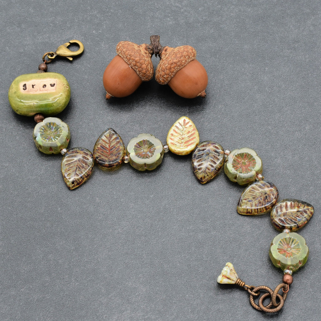 This image shows a bracelet. The piece has a lobster clasp and a toggle clasp, which are typical for bracelets. The size and arrangement of the beads also suggest it is designed to be worn around the wrist.