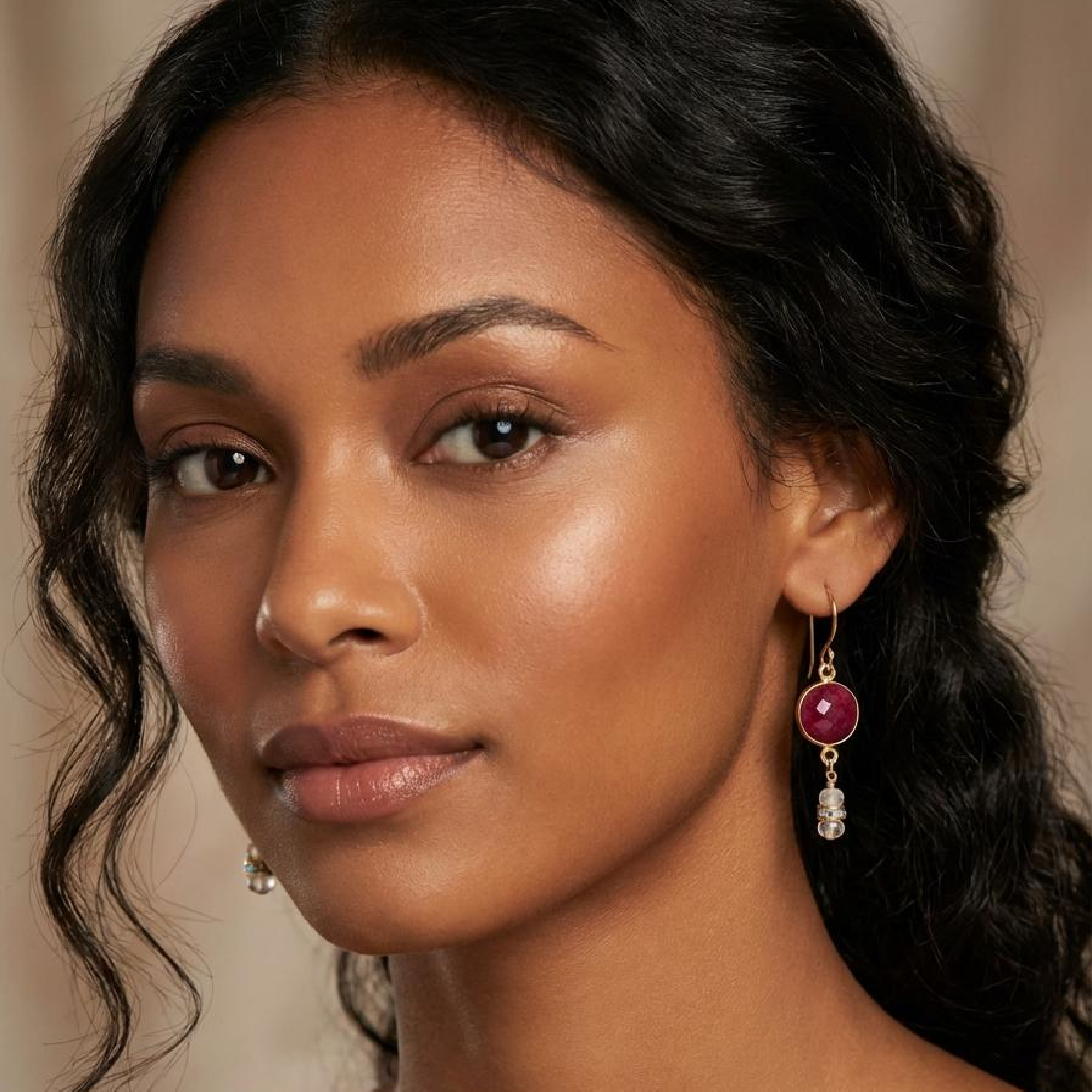 Close-up of a woman wearing earrings with a blurred background