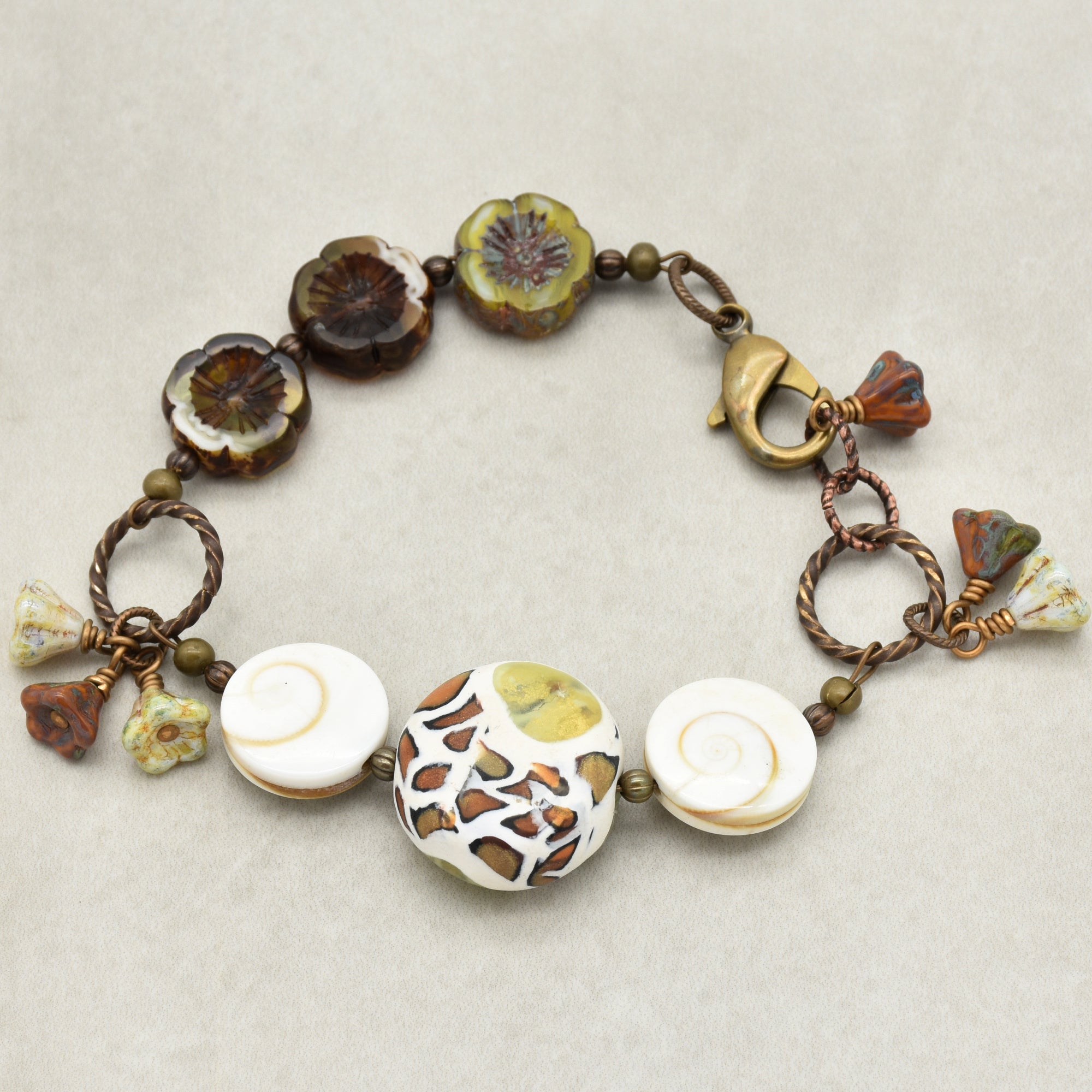 Swanky Safari Handmade Beaded Bracelet with Artisan Polymer Clay Green Giraffe Focal, Shell, Czech Glass Flowers