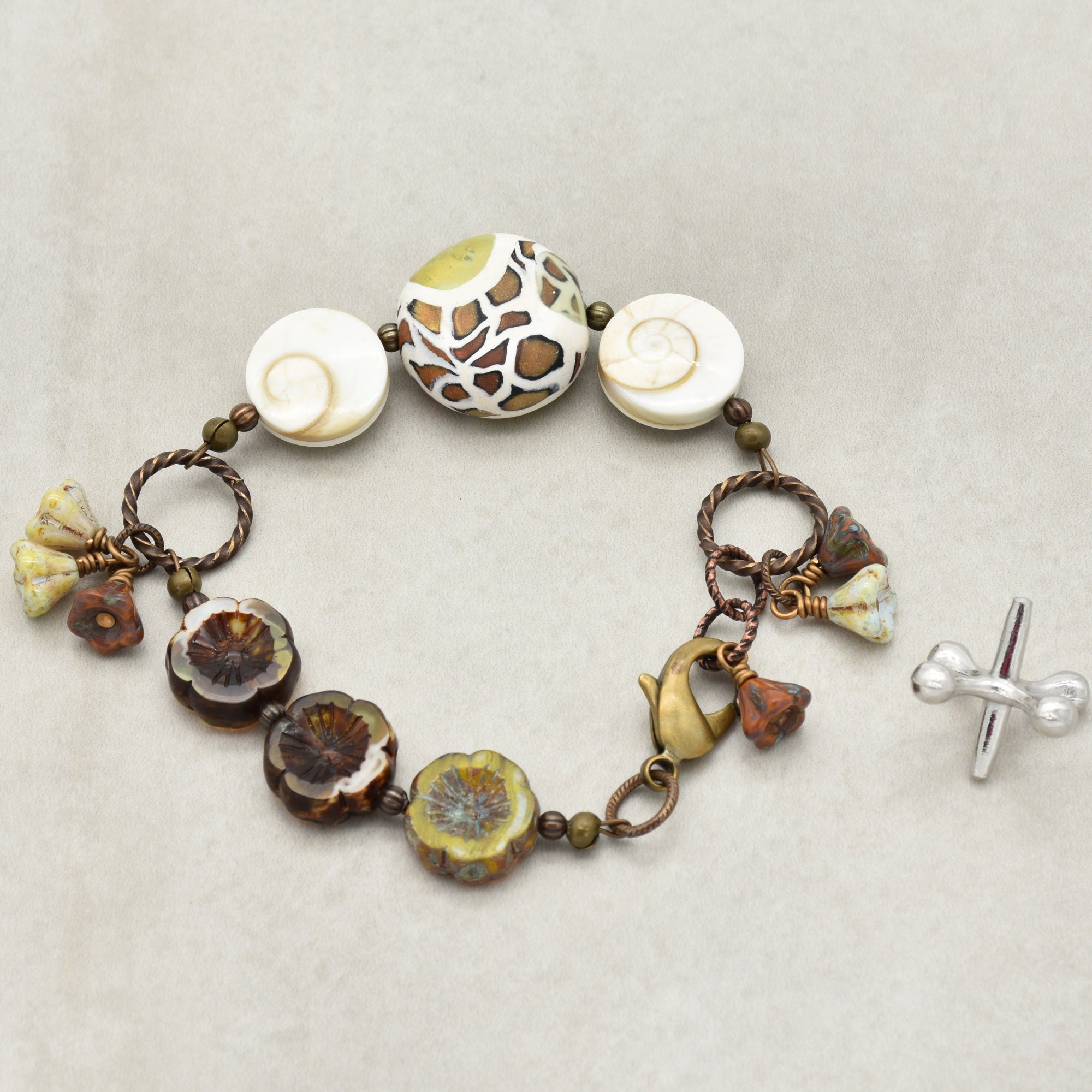 Swanky Safari Handmade Beaded Bracelet with Artisan Polymer Clay Green Giraffe Focal, Shell, Czech Glass Flowers