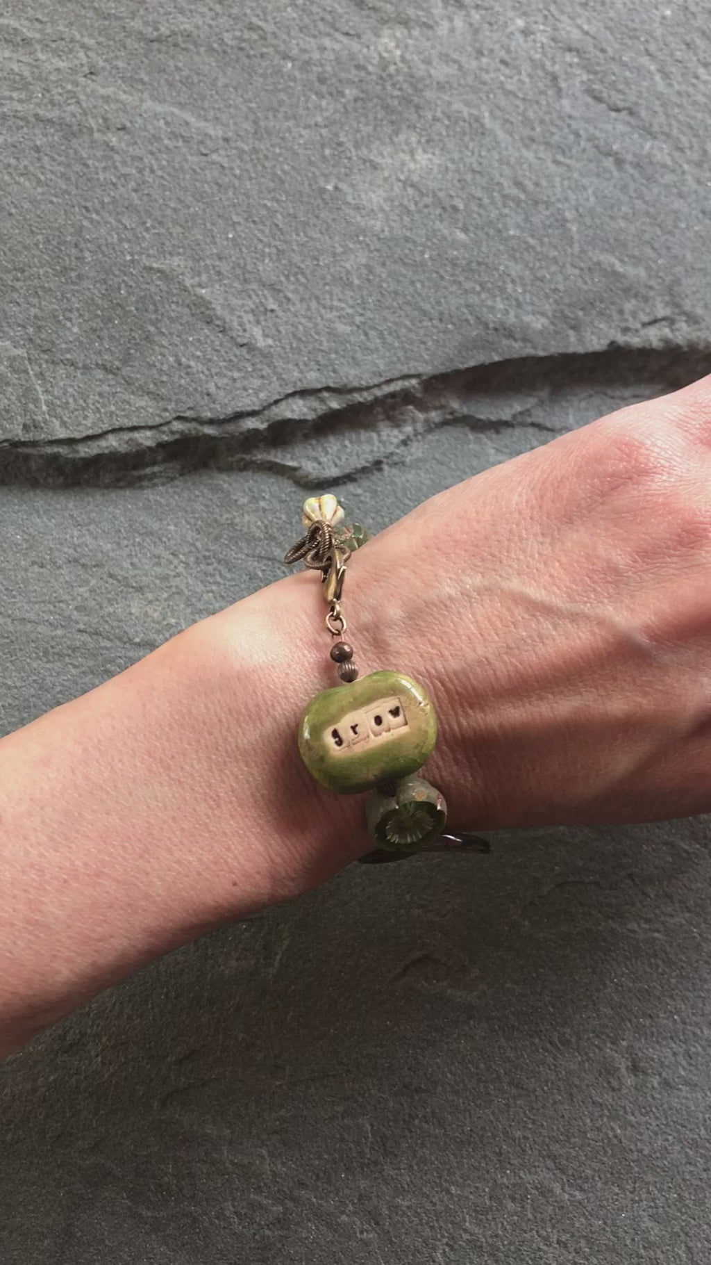 video of hand wearing Grow bracelet