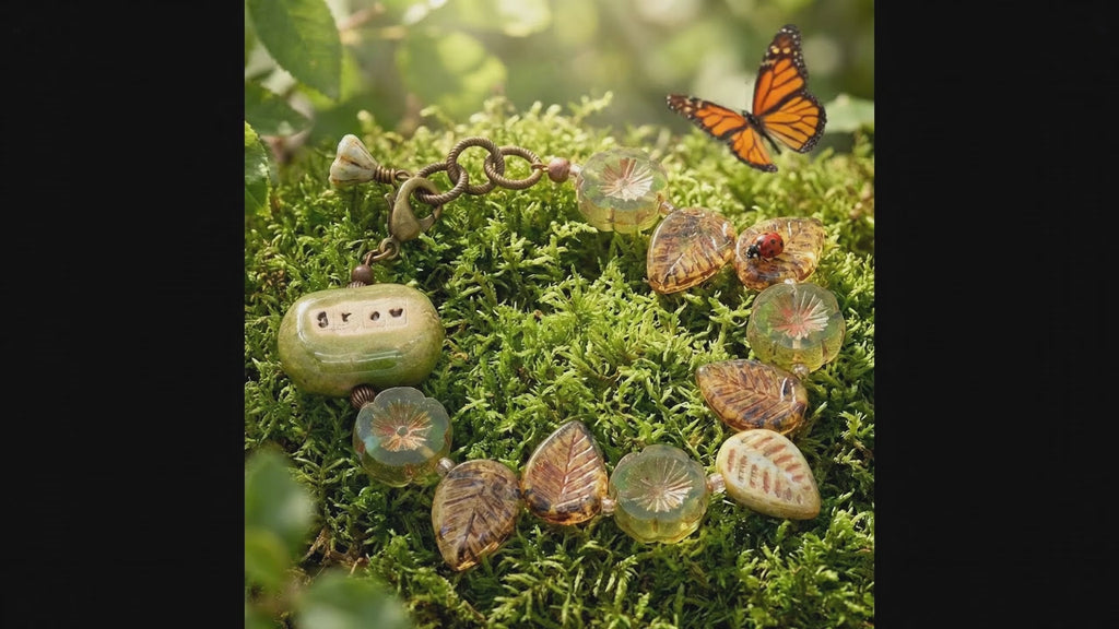 Video of a colorful beaded bracelet with a focal that reads Grow and a butterfly softly batting its wings