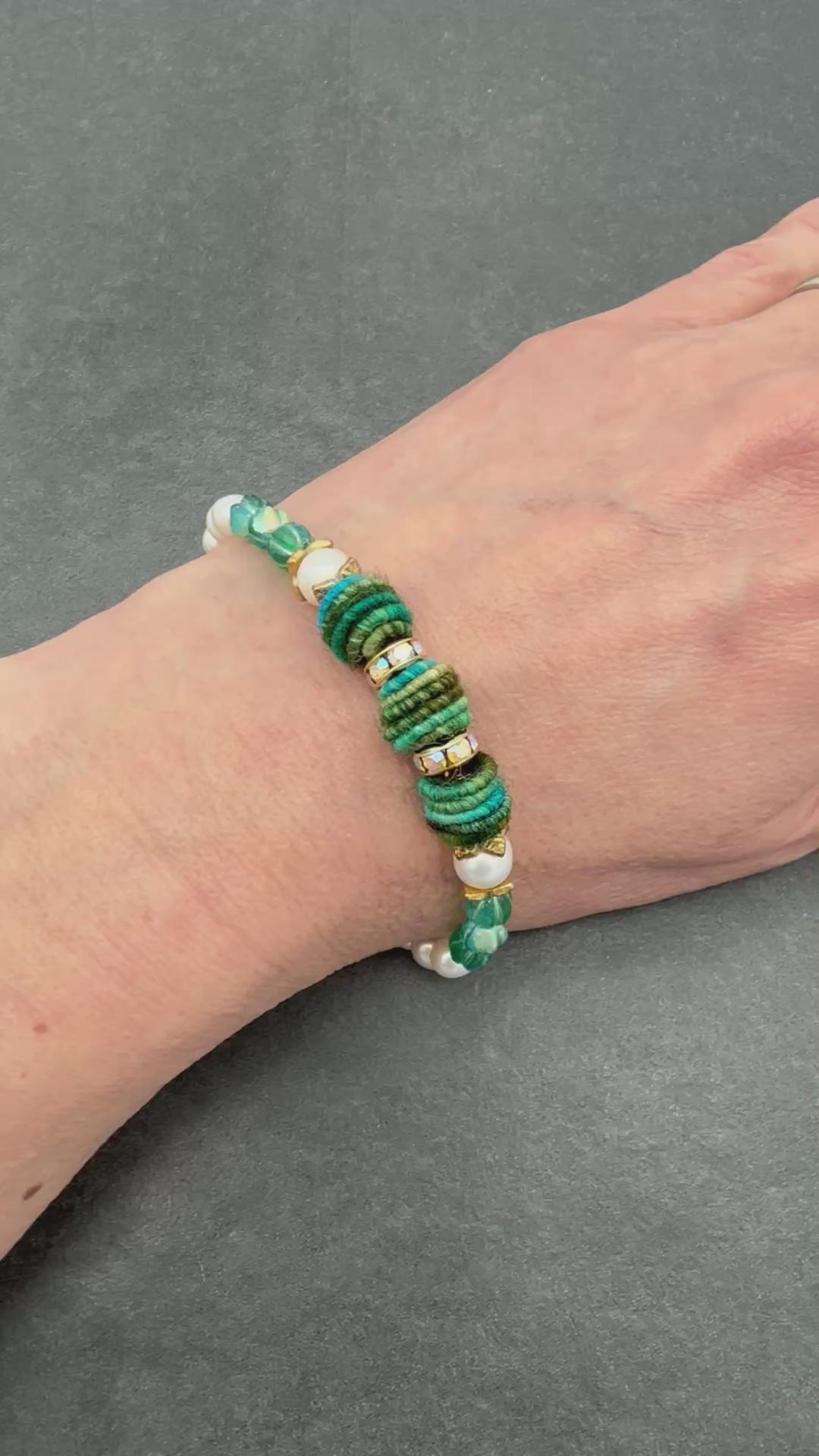 Video of hand wearing festive beaded bracelet