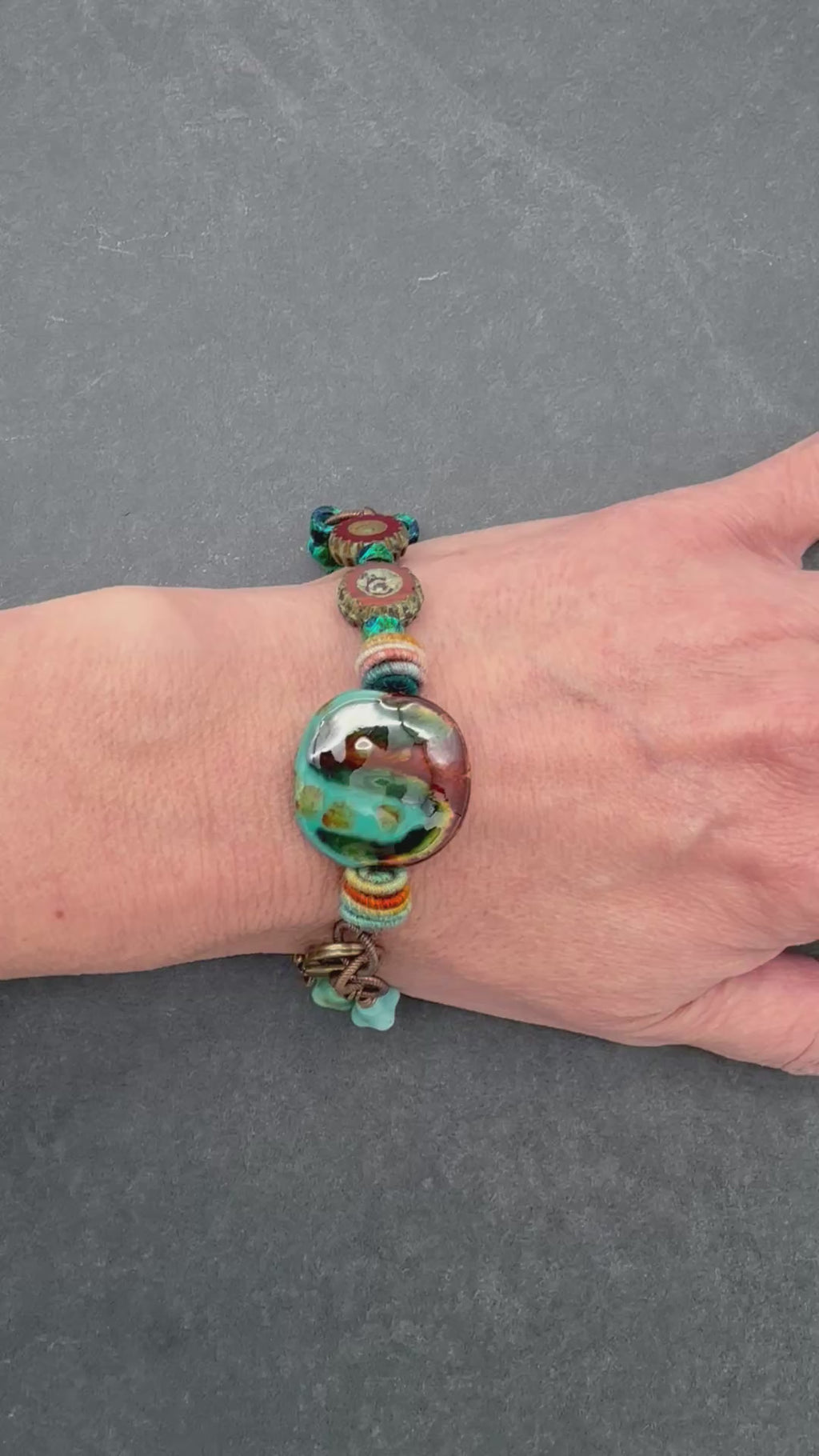 video of hand wearing Tierra earth tone handmade beaded bracelet