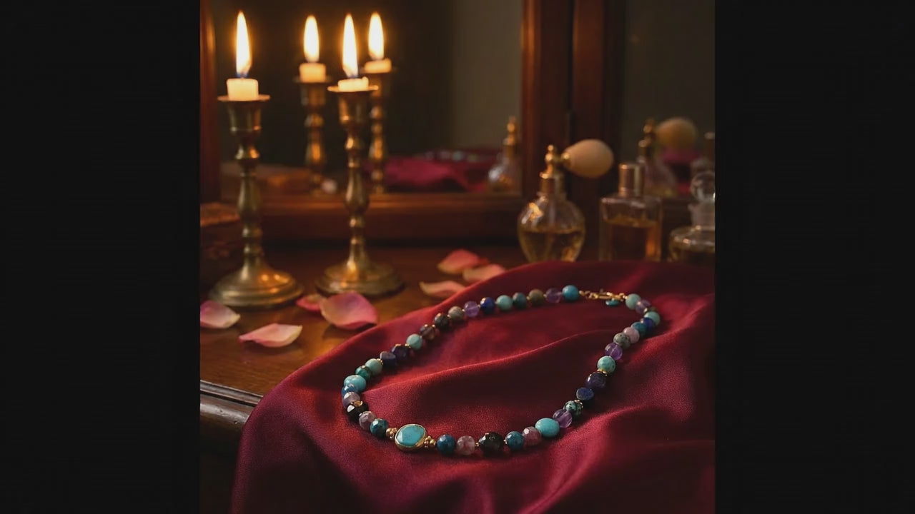 Video of a multi stone necklace displayed on a red satin cloth