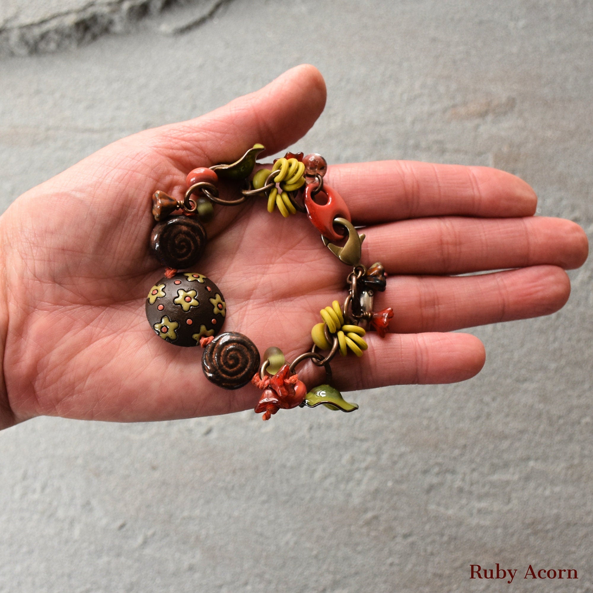 Fiesta Handmade Olive Green and Orange Bracelet with Artisan ceramic, artisan enameled flowers, artisan lampwork glass, Czech glass