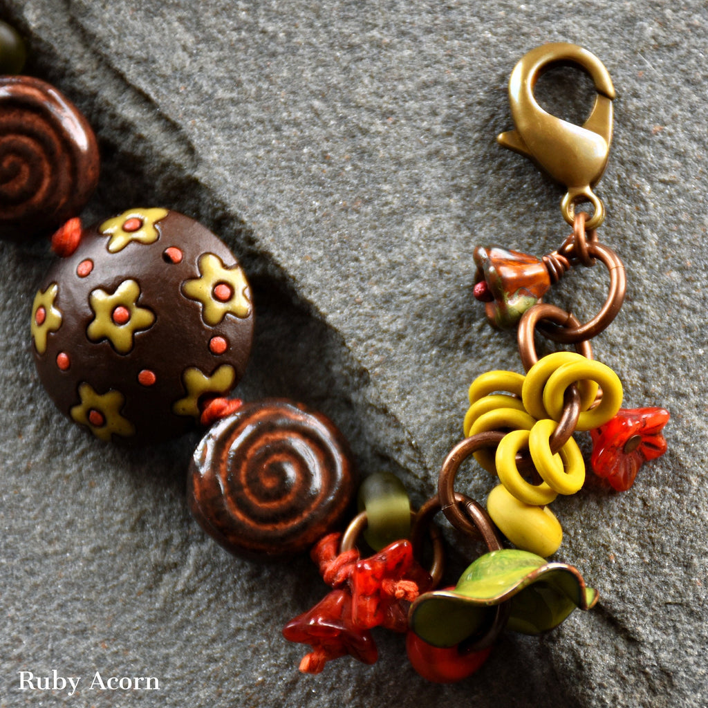 Fiesta Handmade Olive Green and Orange Bracelet with Artisan ceramic, artisan enameled flowers, artisan lampwork glass, Czech glass